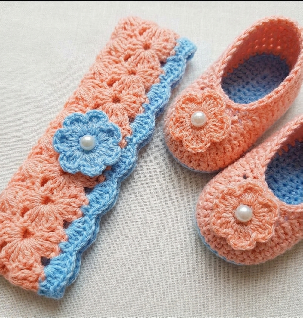 Peach and sky blue crochet baby booties with flowers and pearls