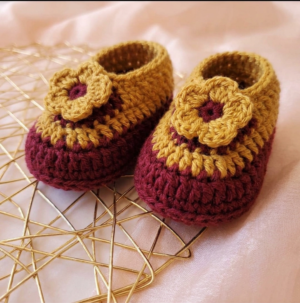 Mustard and maroon crochet baby booties with flowers