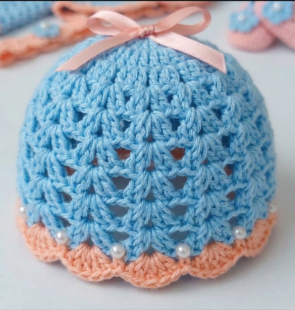 Sky blue and peach crochet baby bonnet with pearls and ribbon ties