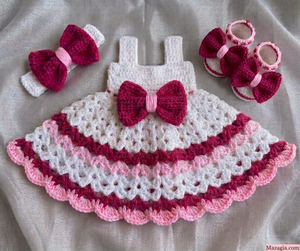 White crochet baby dress with maroon and pink stripes, bow headband and booties