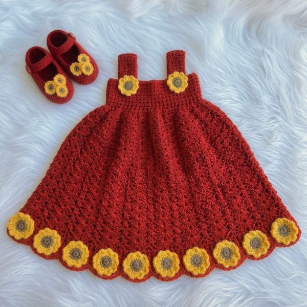 Rust red crochet baby dress with sunflower hem and matching booties