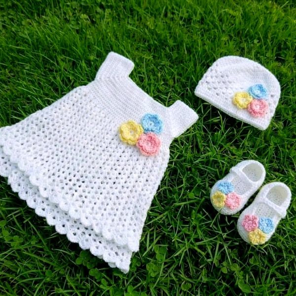 White crochet baby dress set with cap and booties