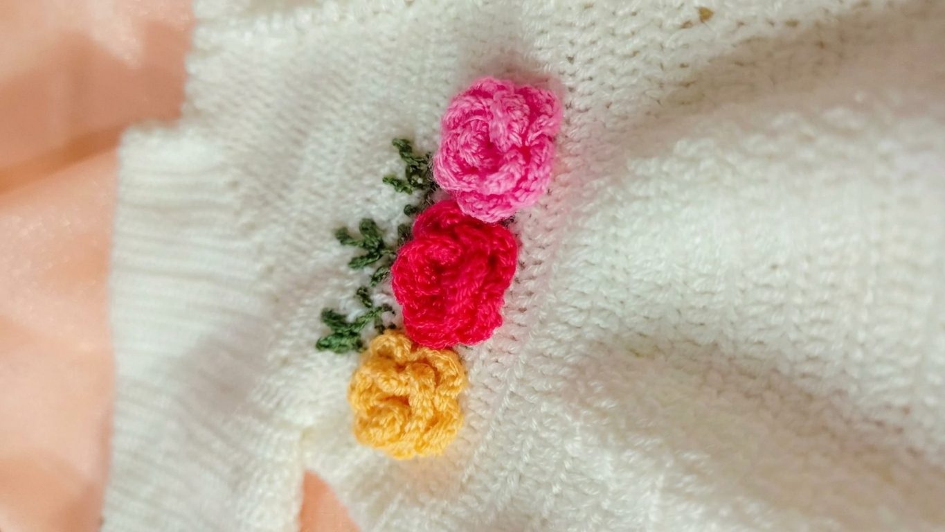 white crochet frock with 3 color flower
