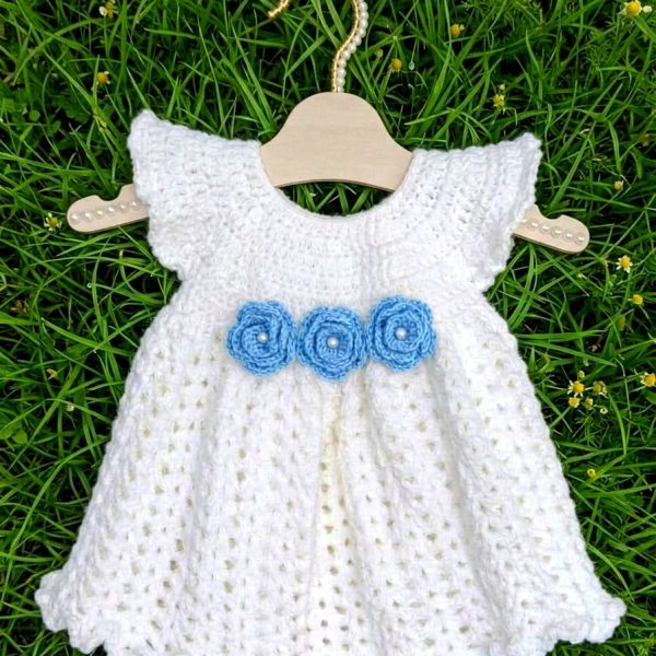 White crochet baby dress with sky blue roses
