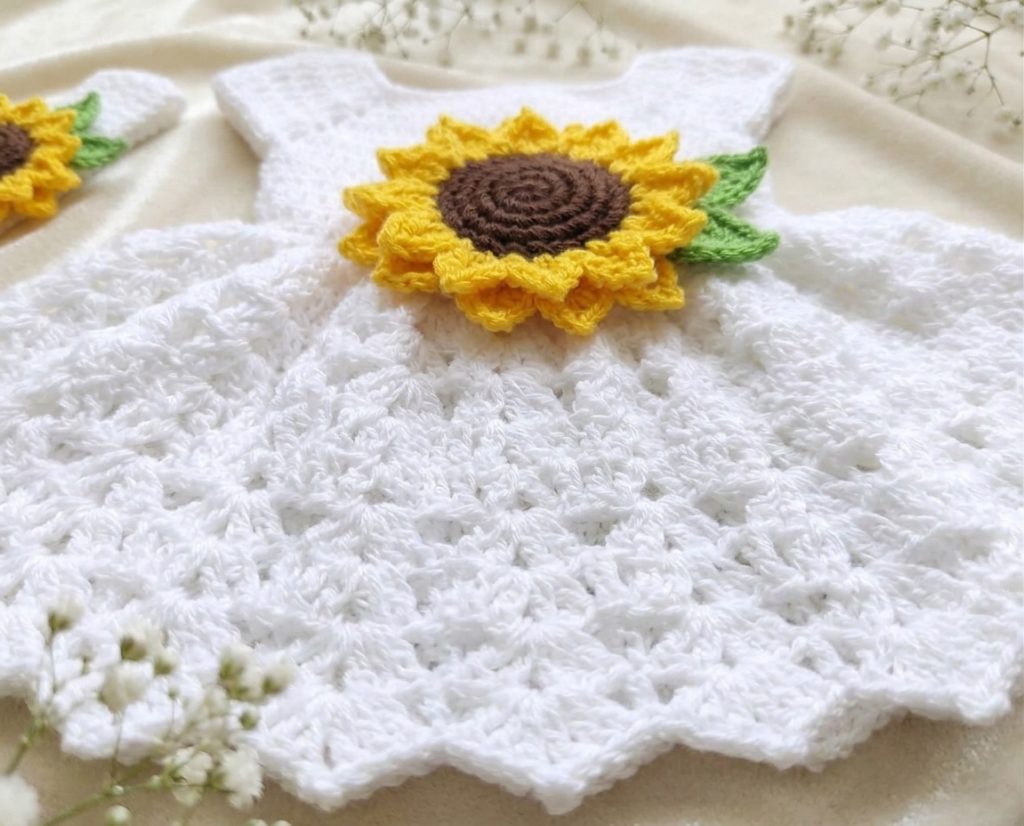 White crochet baby dress with big yellow sunflower, headband and booties