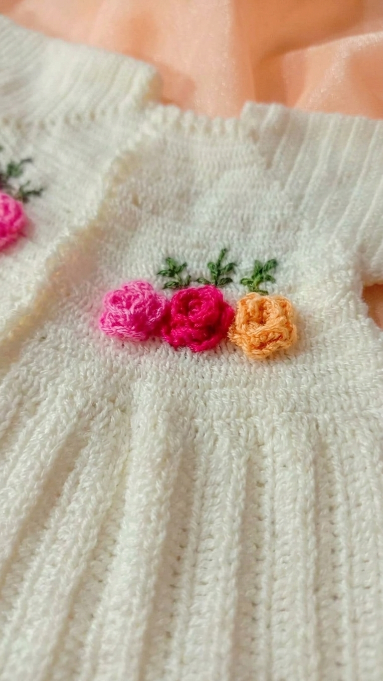 white double crochet stitch frock with 3 color flowers