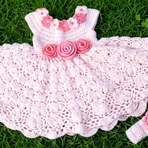 Pink and white crochet baby dress with booties